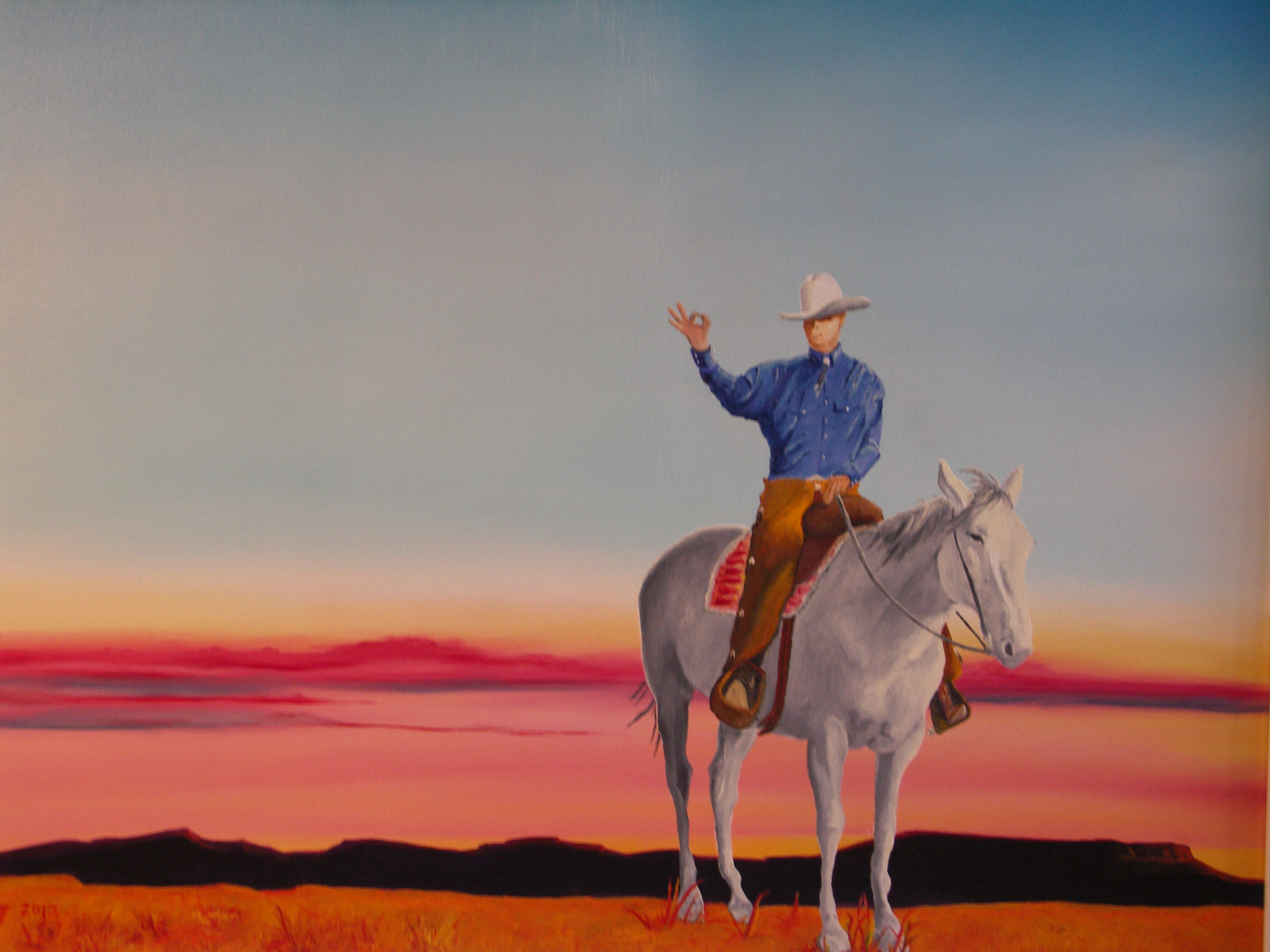 painting of cowboy on white horse with pink and blue sunset and mesa in background