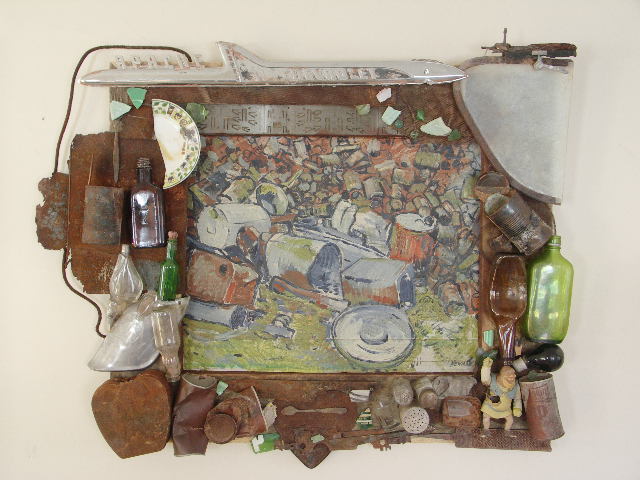 repurposed cans, bottles and trinkets around a painting of cans