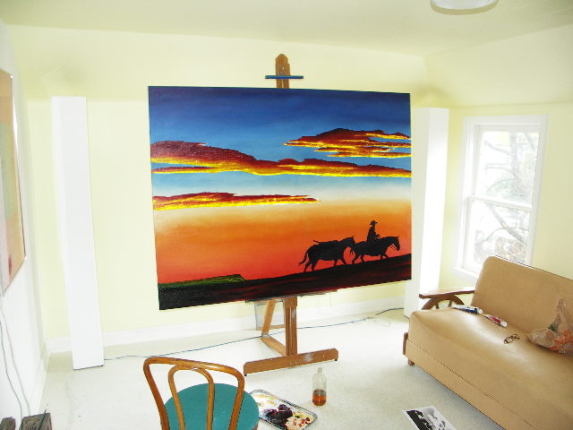 painting of two horses and one cowboy in the desert at sunset