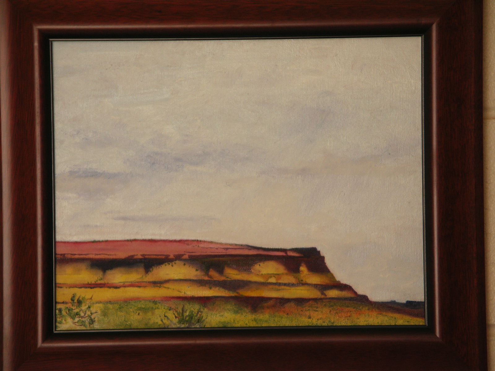 painting of white cloudy sky and yellow mesa